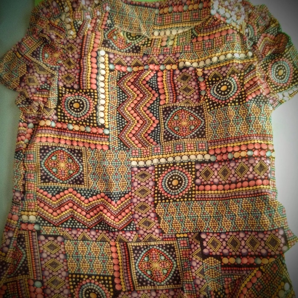 Brand new woman’s shirt with necklace.